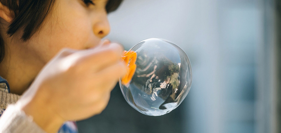 Child blowing bubble